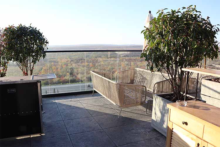 Natural Stone-Finish Balcony Tile Design Idea